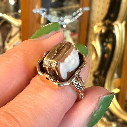 Flip gold antique ring with a cameo and a stone.